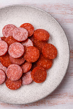 Slices of smoked pepperoni or salami for making homemade pizza. Sliced pepperoni