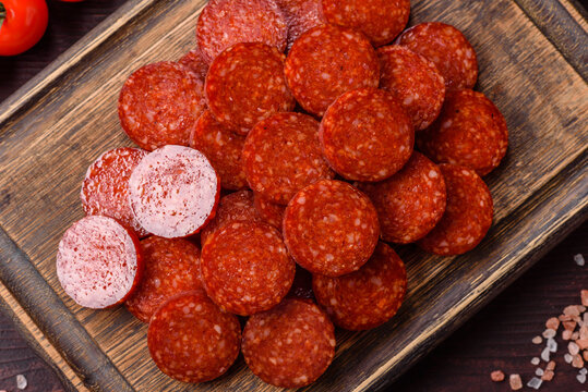 Slices of smoked pepperoni or salami for making homemade pizza. Sliced pepperoni