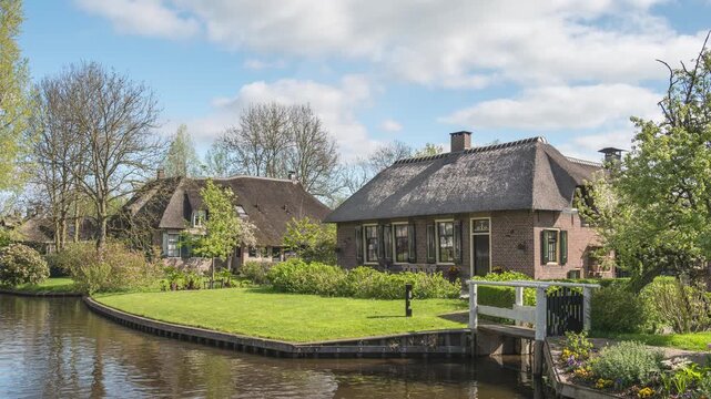 Giethoorn Netherlands time lapse at canal and traditional house in village