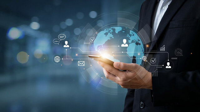 Businessman using smartphone with global network and digital connections overlay technology