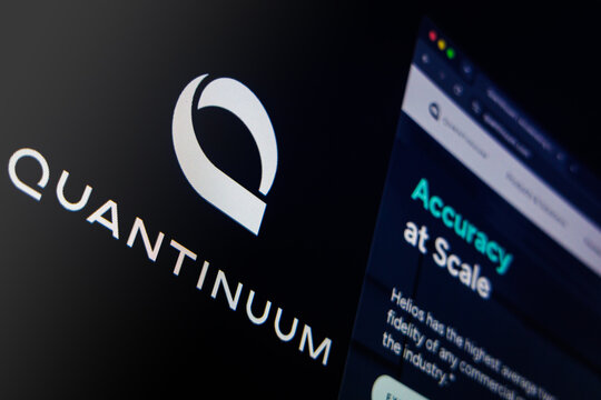 Raleigh, North Carolina - August 2, 2026: Quantinuum logo beside a website page on a dark screen.