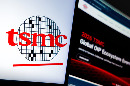 Raleigh, North Carolina - August 2nd, 2026: TSMC logo beside a website page on a dark screen.
