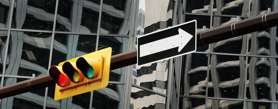 Traffic Light on Pole with City Buildings or Skyscrapers in the Background for Big City Environmentt