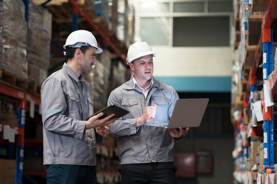 Team of warehouse worker manage inventory, process incoming and outgoing stock, organizes and fulfill orders inside a storage or distribution facility