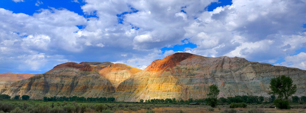 Desert Cliffs Landscape in America USA Wilderness Land with Blue Sky and Puffy Clouds