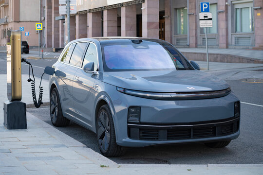 MOSCOW, RUSSIA - JULY 20, 2026: Chinese hybrid car of the Li L7 powered by urban electric charging. Moscow