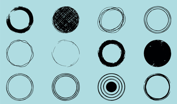 Collection of various distressed circular grunge frames and solid black ink circles on a light blue background with distressed textured collection circular abstract isolated decoration