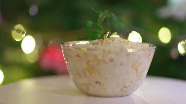 Creamy Salad Dish with Parsley Garnish and Festive Bokeh Background