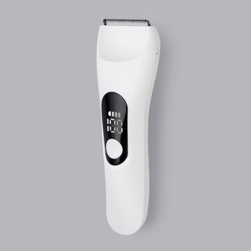 Product photography of a waterproof white electric beard trimmer and hair clipper, isolated on a clean neutral grey background.