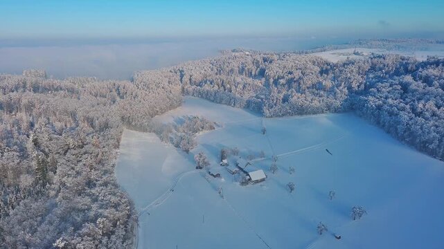 Aerial View of Pristine Snow-Covered Winter Landscape with Farmhouses