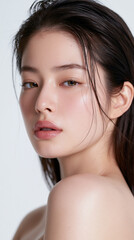 Fototapeta premium clean beauty portrait of japanese woman with short black hair, natural makeupfree japanese woman portrait with fair skin and almond eyes