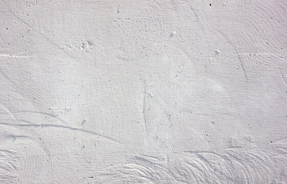 An authentic gray plastered wall of a building. A gray surface of the building with space to copy the image and insert text. A concrete wall, wallpaper, background.