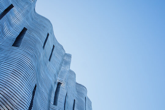 Unique iron design of facade in business, art and shopping mall Stary Browar in Poznan, Poland under clear blue sky on 4th of March, 2026 in Poznan, Poland