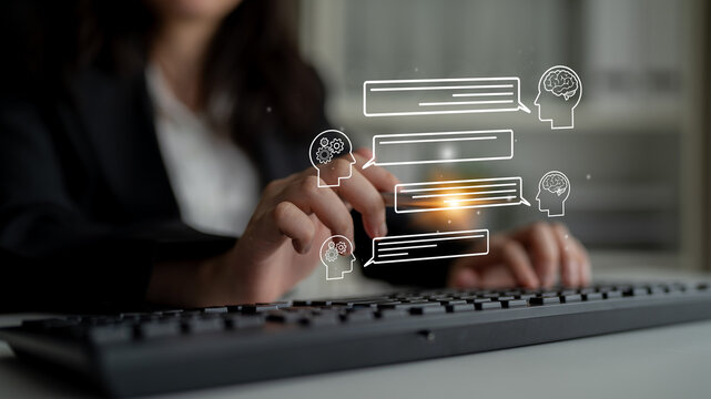 Business professional engaging in digital communication with chat icons and graphics representing conversation and collaboration in an office setting. Entropy.