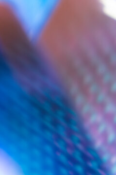 Stock Abstract Ethereal Gradient Noise Blur Vertical Background with Diffused Blues, Purples, and Reddish-Brown Hues, Featuring Soft Focus and Subtle Bokeh for Overlay Use