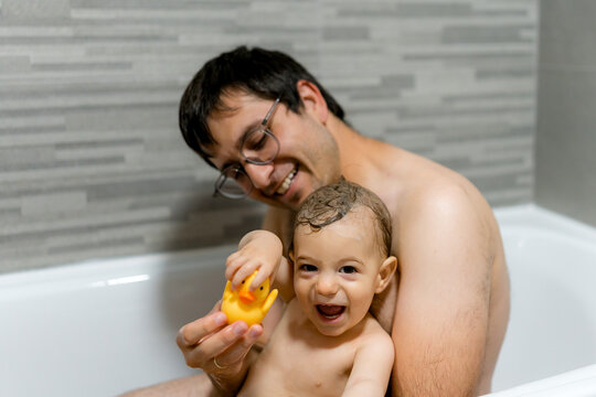 Bath time joy with father and baby in the bathroom