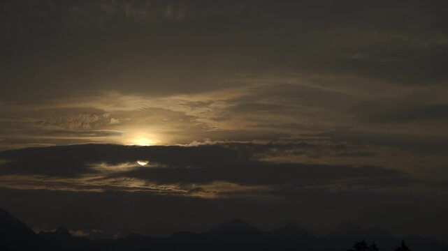 Sun rising from behind the cloud, sunrise dawn with clouds video time lapse
