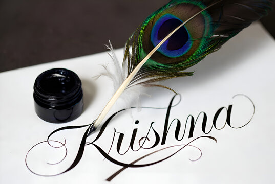 feather pen and inkwell writing a name
