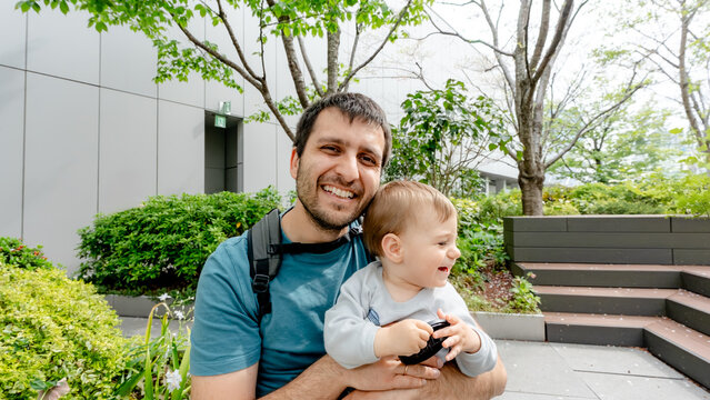 Father and baby enjoying time in Tokyo garden