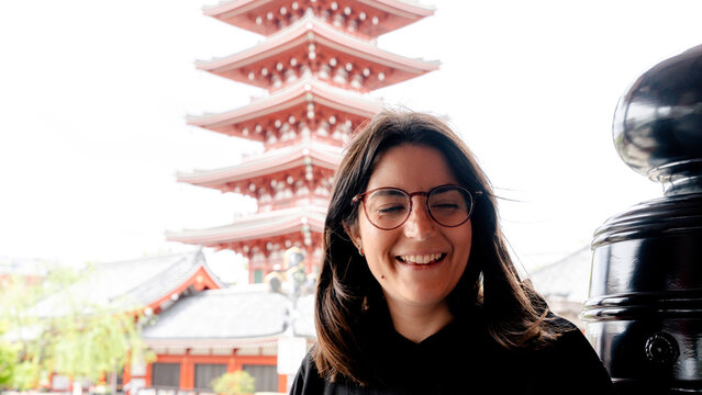 Smiling visitor at Senso-ji Temple in Tokyo