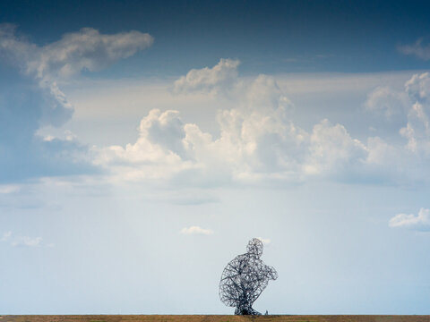 landscape art the Crouching man by Antony Gormley in Lelystad