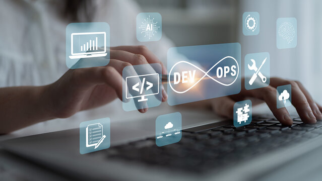 Hands typing on a laptop keyboard surrounded by various digital icons representing software development, operations, coding, cloud technology, and automation concepts in a modern workspace. Glyphic.