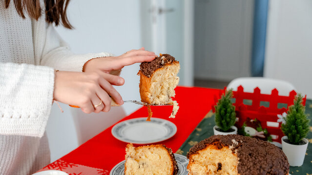 Serving a Slice of Panettone for New Year Breakfast at Home