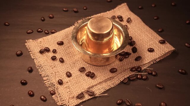 A traditional south indian Brass cup and over beans