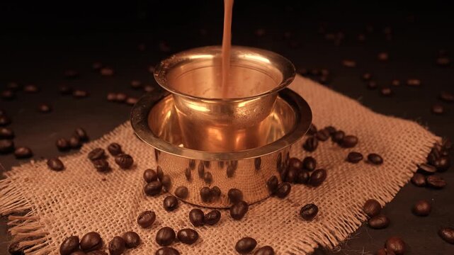 A traditional Indian Filter Coffee served in brass cup