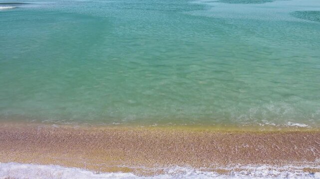 Cream ice, ice fat on Azov Sea. In calm, frosty weather, even salt water freezes, pancake ice forms, and when pores filled, ice crystals merge into flexible mass that extinguishes waves. Foam hardens