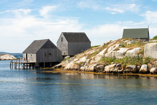 Old fishing village in New England with a rocky coast and wooden buildings on the waterfront