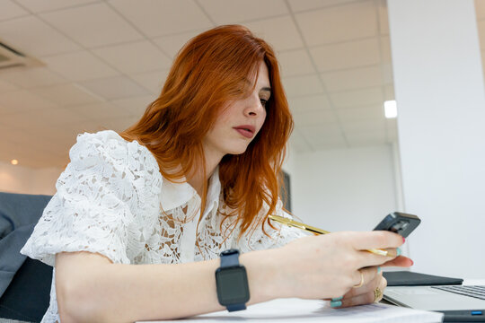 MBA student use smartphone during business class