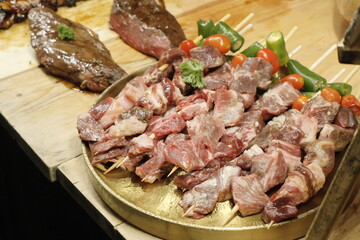 Fototapeta premium Medium-rare grilled steak sliced and served on a platter.