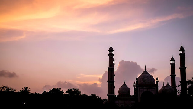Silhouette of grand mosque minarets and domes against a dramatic sunset sky with silhouette religious architecture tradition twilight building peaceful spirituality landscape landmark