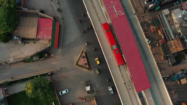 Metro bus leaving station on elevated road urban public transport concept