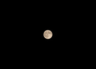 Bright Full Moon in Clear Night Sky with Copy Space © Nadia