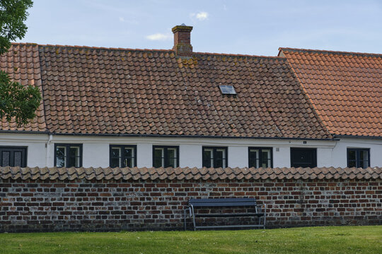 View of historic middle age houses along the churchyard of St-Catharina church in Ribe, Denmark.