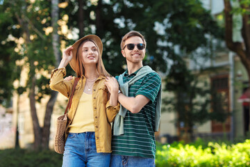 Fototapeta premium Happy couple walking together on city street