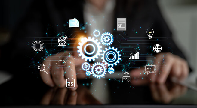 Conceptual image showcasing digital innovation and technology, featuring gears, data icons, and business symbols displayed against a dark blurred background. Entropy.