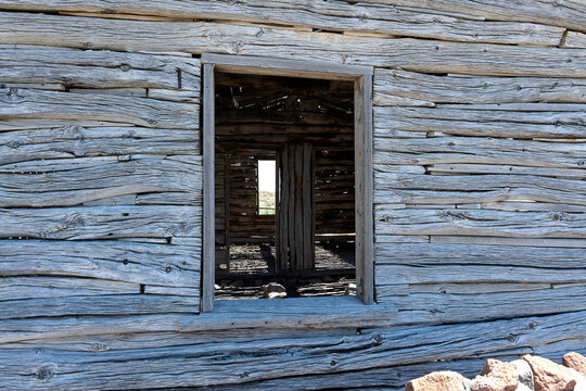 Wooden cabin view of shadows inside through window