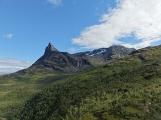 Obraz premium Dramatic Mountain Peak and Waterfall Near Narvik, Northern Norway