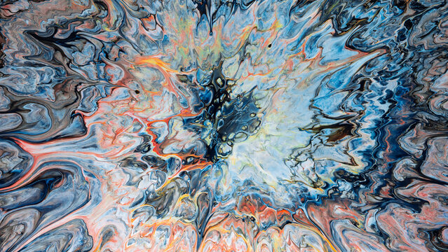 abstract poured paint explosion with swirling marbled patterns and central burst