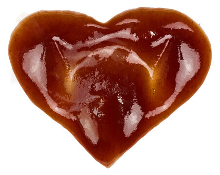 Spilled barbecue sauce in heart shape on isolated background