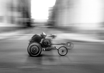Philadelphia Marathon - Wheelchair racer speeds down the track with motion blur in a black and white shot © HENRY ROWAN