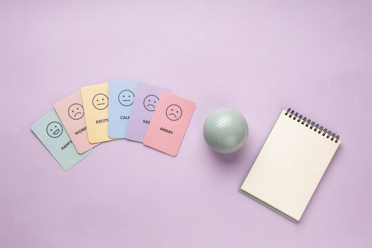 Understanding and Tracking Emotions Colorful Cards with Facial Expressions Paired with a Blank Notebook for Personal Mood Assessment and Mental Well-being Reflection