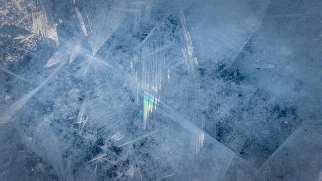 macro abstract texture of cracked blue ice with refraction
