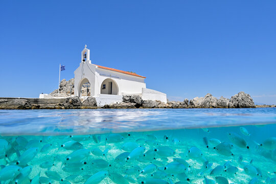 Half underwater image of Chapel Saint Isidore of Sykiad, Chios Island, Greece       