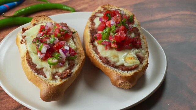 Mexican molletes. Clean food presentation of traditional Mexican open-faced sandwiches