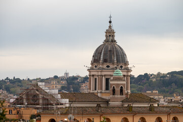 Naklejka premium City view on roofs and churches of Rome from panoramic route near villas Borghese and Medici, walking in Rome in spring evening, soft sunset lights, guided tour