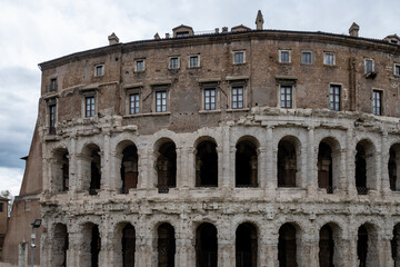 Obraz premium Architectural history in details of ruins, old buildings, walls, amfitheatres, arches in old part of Rome, dated from 300 BC, guided tours in Rome, Italy